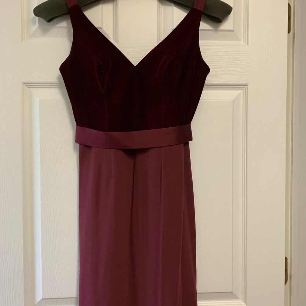 Wine colored size 4 gown . Velvet bodice with polyester bottom.